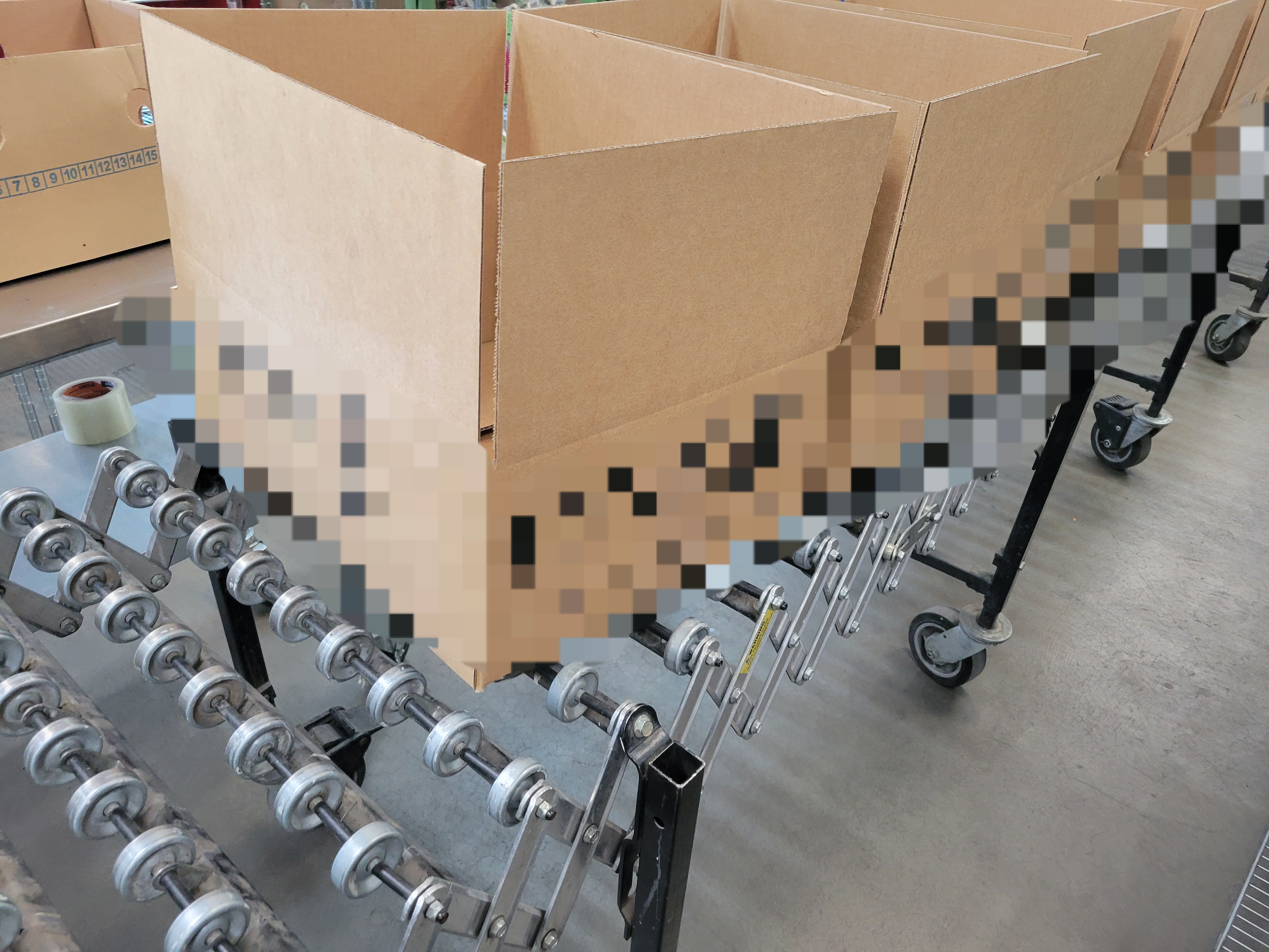 Cardboard boxes on a conveyor belt.